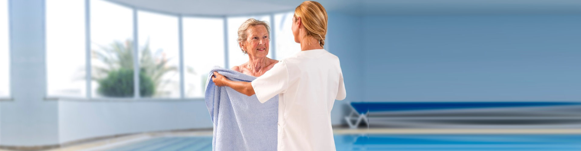 a woman covering an elderly woman